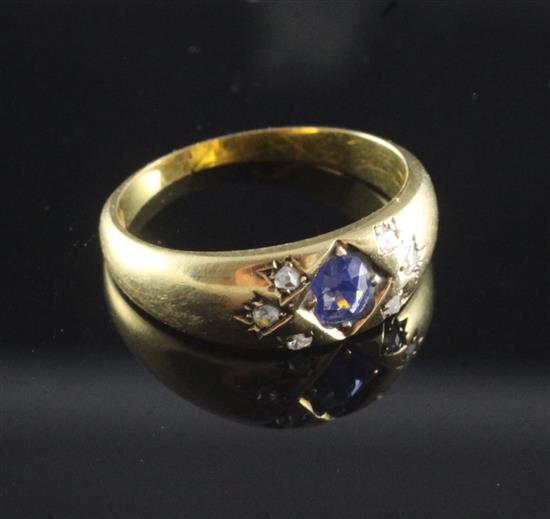 A late Victorian 18ct gold, gypsy set sapphire and diamond ring, size L.